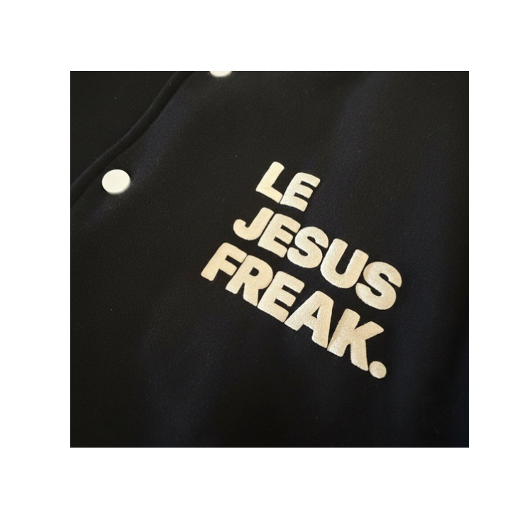 Bomber Jacket with 'LE JESUS FREAK' text in white on a white background